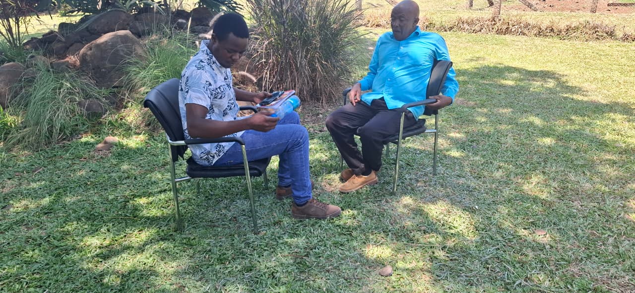 CarboDeep Senior Enumerator Urbanus Mwanzia conducting a socio-economic survey with a leader from the Mwea Rice Paddy Irrigation Water User Association.
